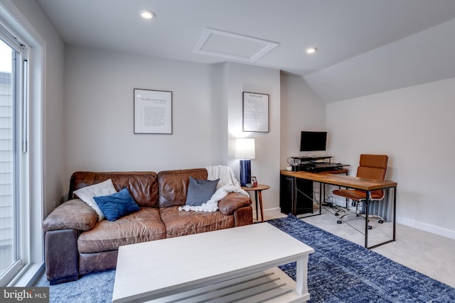 office area with light carpet and lofted ceiling