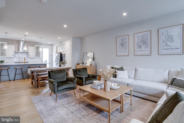 living room with light hardwood / wood-style floors