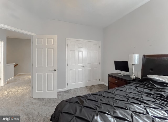 carpeted bedroom with a closet