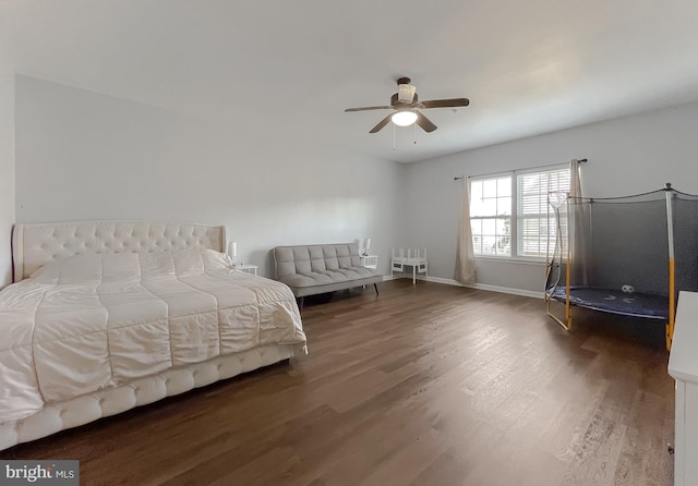 bedroom featuring ceiling fan and dark hardwood / wood-style floors