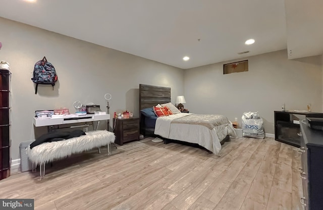 bedroom with light hardwood / wood-style flooring