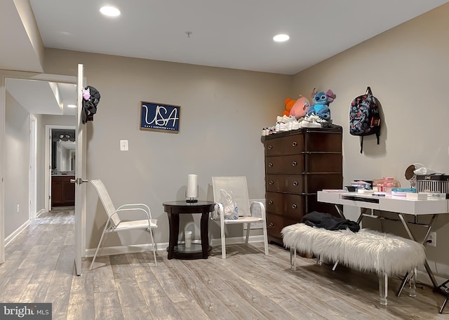 sitting room featuring light hardwood / wood-style floors