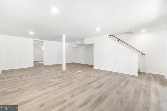 basement featuring light wood-type flooring