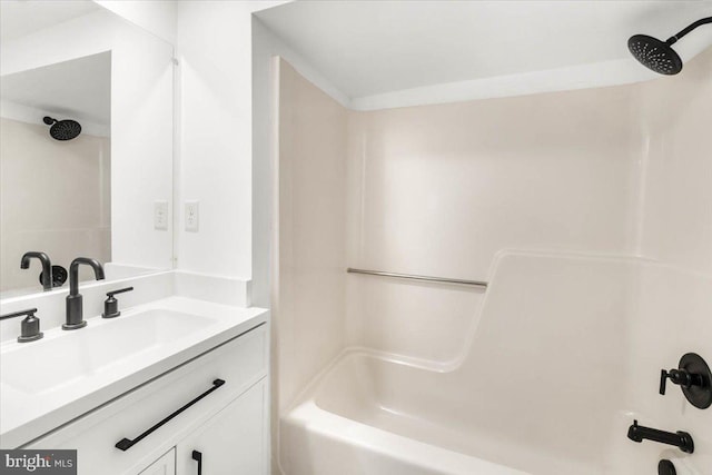 bathroom featuring shower / tub combination and vanity