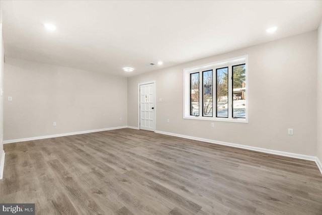 unfurnished room featuring wood-type flooring