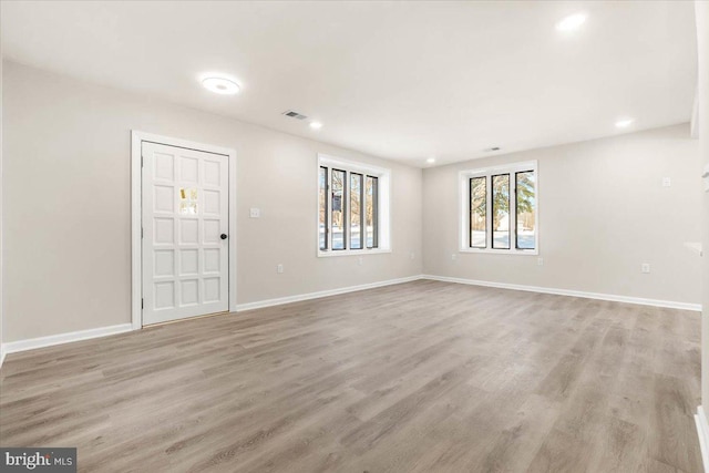 unfurnished room with light hardwood / wood-style flooring