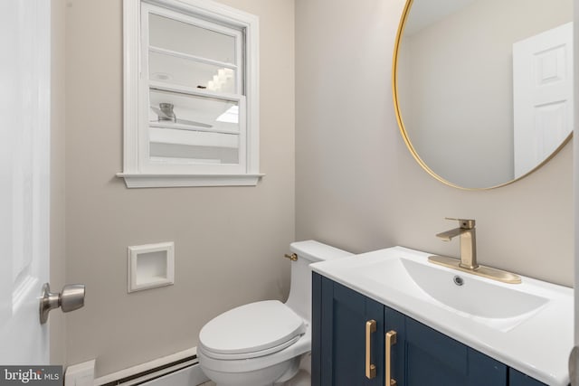 bathroom featuring a baseboard radiator, toilet, and vanity