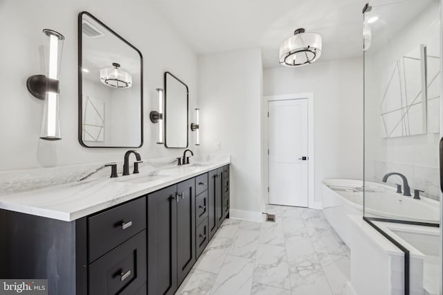 bathroom featuring vanity and a bathing tub