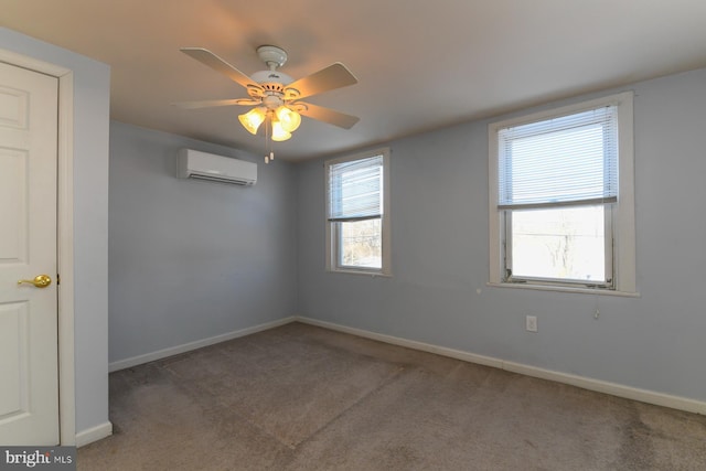 empty room with carpet flooring, a wall mounted air conditioner, and ceiling fan