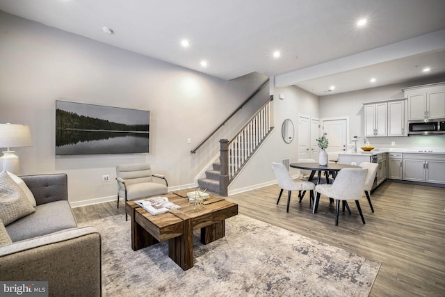 living room with sink and hardwood / wood-style flooring