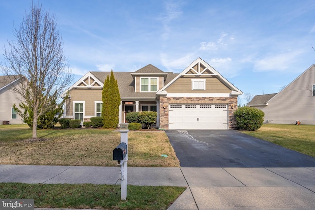 craftsman-style home with a front lawn and a garage