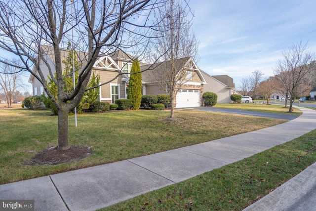 view of front facade with a garage and a front yard