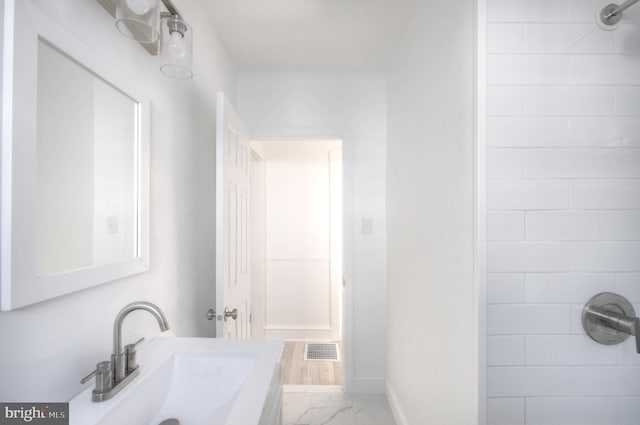 bathroom with a shower and sink