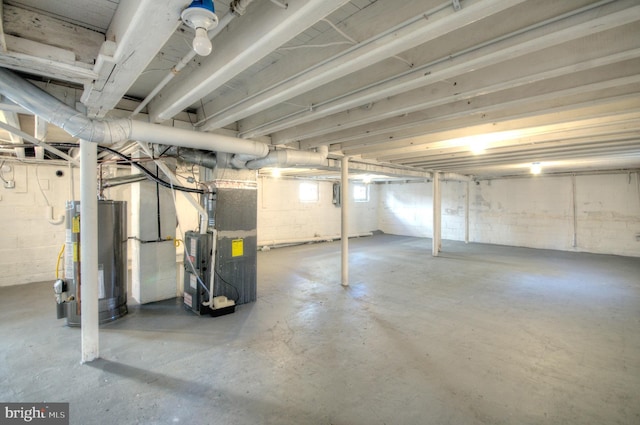 basement with heating unit and water heater