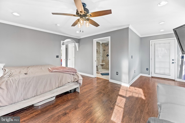 bedroom with ornamental molding, dark hardwood / wood-style floors, ensuite bathroom, and ceiling fan