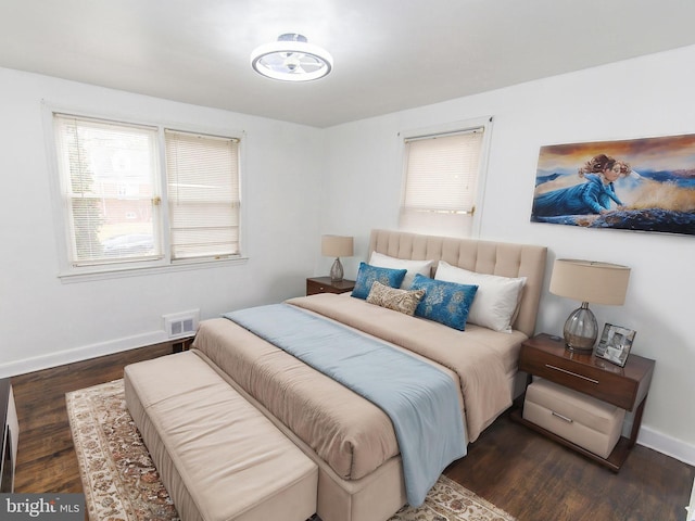 bedroom featuring dark hardwood / wood-style floors