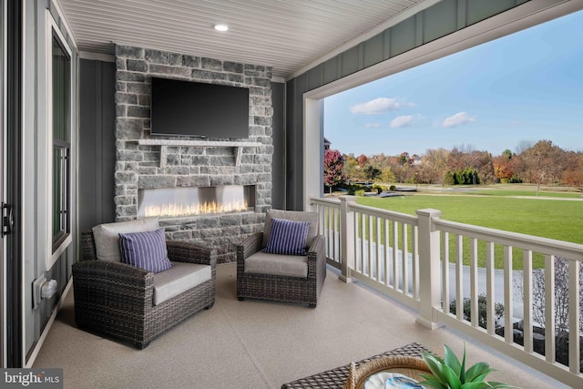 view of patio featuring an outdoor stone fireplace