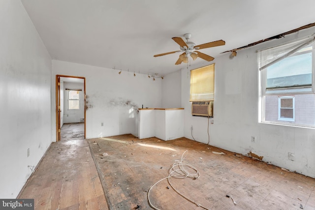 spare room featuring cooling unit and ceiling fan