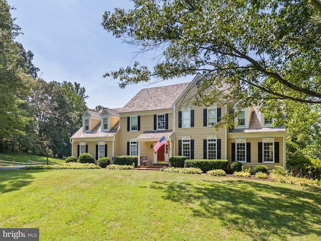 colonial home with a front yard