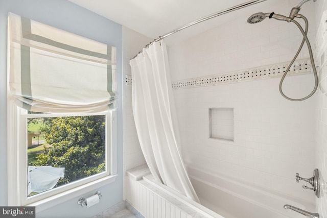 bathroom featuring shower / bathtub combination with curtain