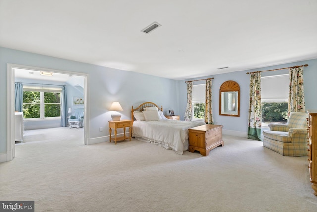 bedroom featuring light colored carpet