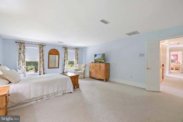 bedroom with light carpet