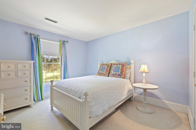 bedroom with light colored carpet