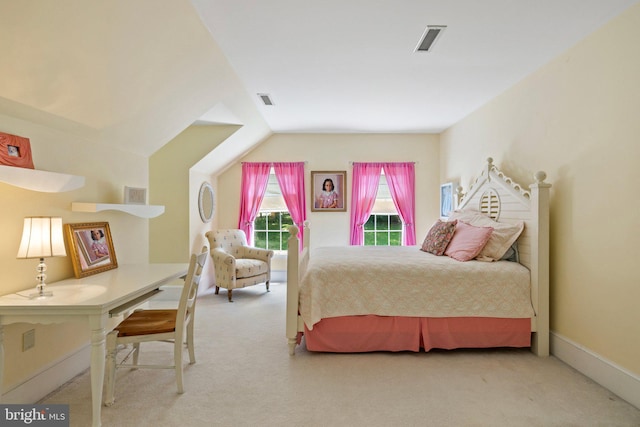 carpeted bedroom featuring vaulted ceiling