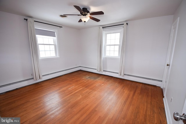 unfurnished room with hardwood / wood-style floors and ceiling fan