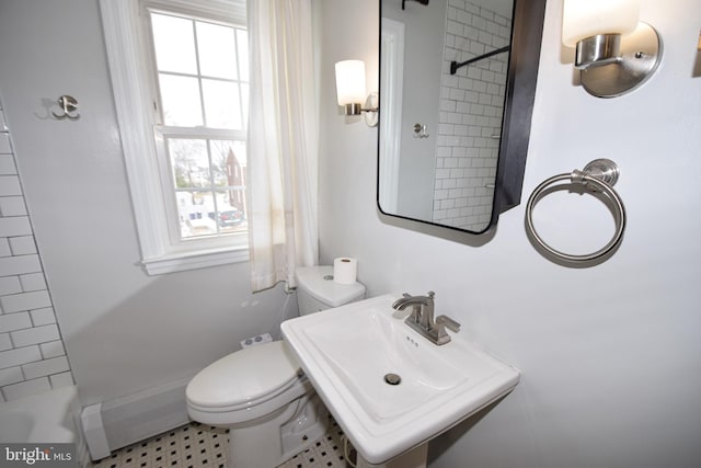 bathroom featuring sink and toilet