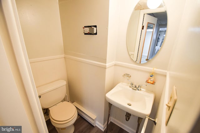 bathroom featuring sink, hardwood / wood-style flooring, and toilet