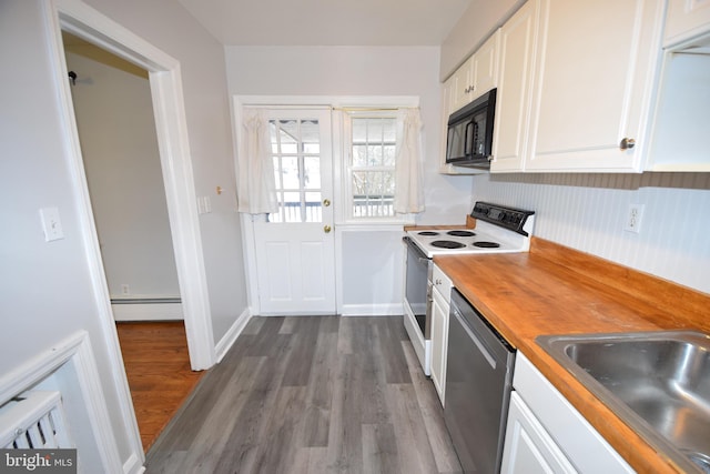 kitchen with white range with electric stovetop, butcher block counters, white cabinets, a baseboard heating unit, and stainless steel dishwasher