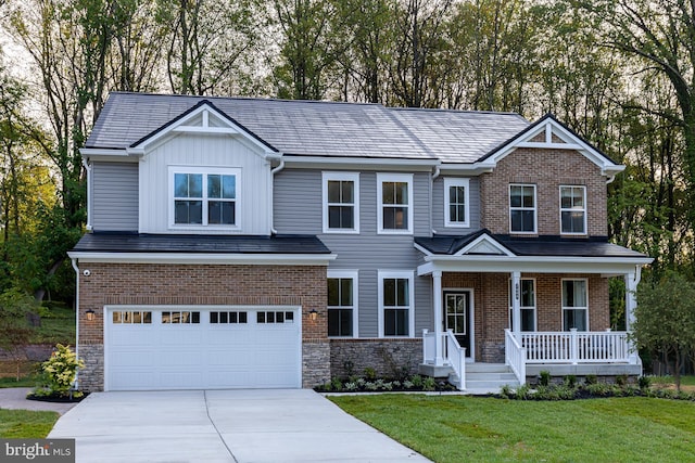 craftsman inspired home with a front yard, covered porch, and a garage