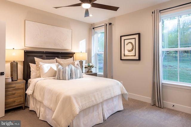 carpeted bedroom with ceiling fan