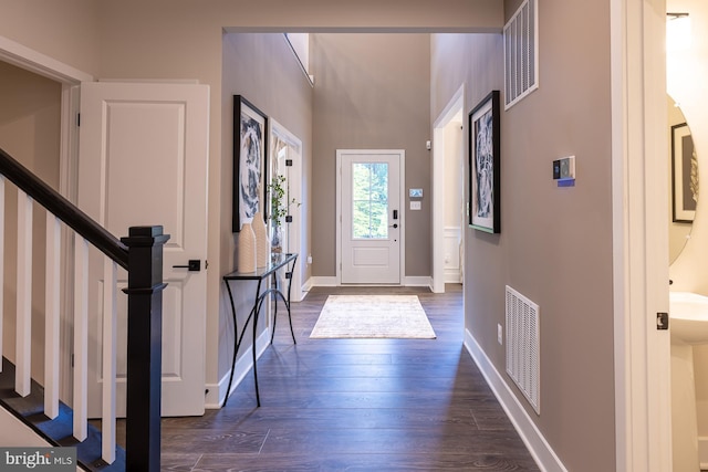 entryway with dark hardwood / wood-style floors