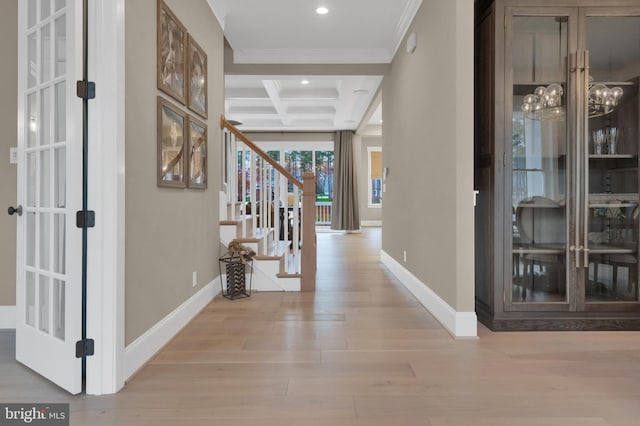 hallway with crown molding, coffered ceiling, light hardwood / wood-style floors, and beamed ceiling