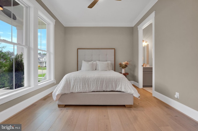 bedroom with ceiling fan, light hardwood / wood-style floors, and multiple windows