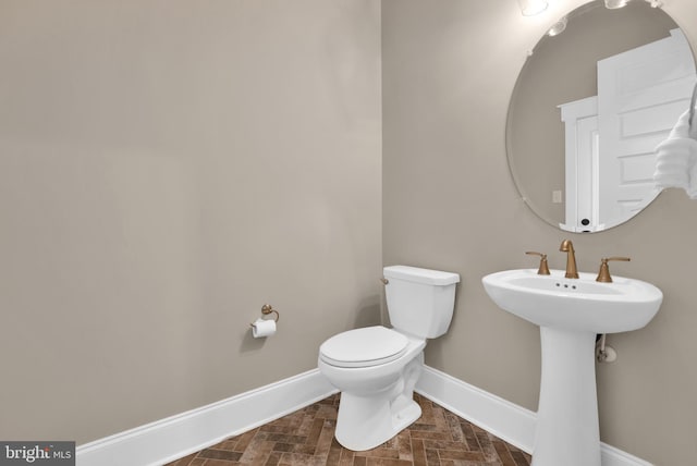 bathroom with sink and toilet