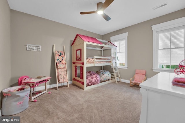 carpeted bedroom with ceiling fan