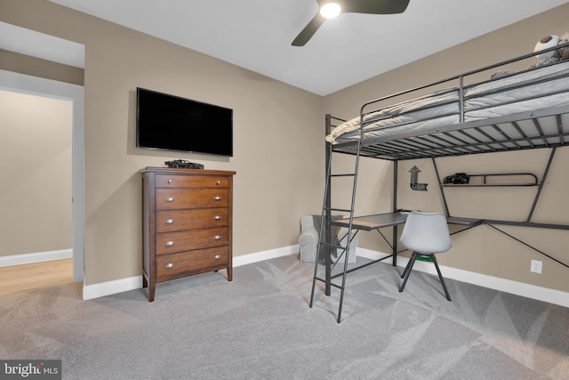 bedroom with ceiling fan and light carpet