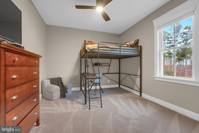 bedroom with light carpet and ceiling fan