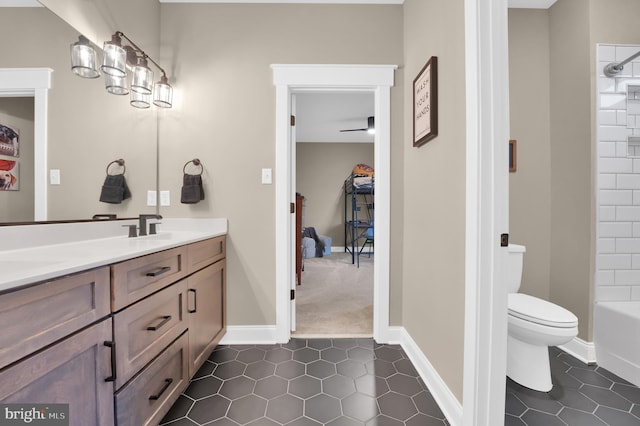 full bathroom with shower / tub combination, tile patterned floors, vanity, and toilet