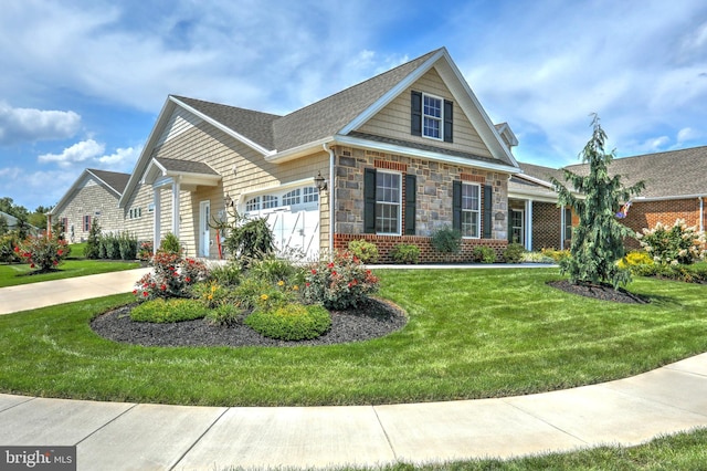 view of front of home featuring a garage and a front lawn