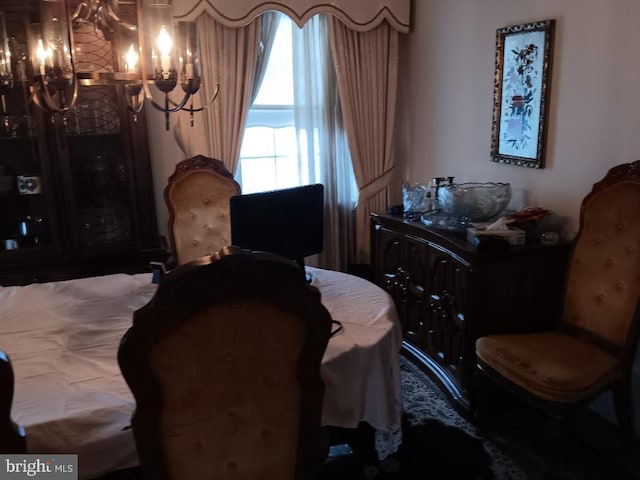 bedroom featuring an inviting chandelier