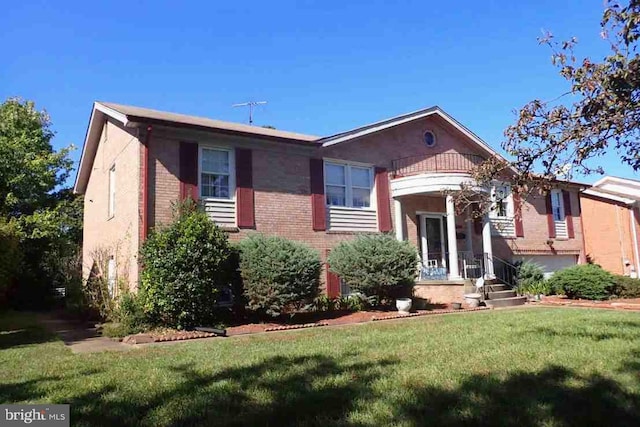 view of front of house with a garage and a front yard