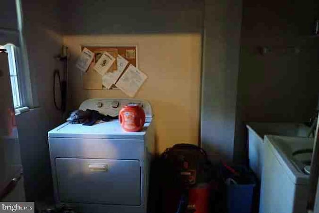 clothes washing area featuring washer / clothes dryer