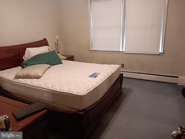 bedroom featuring a baseboard heating unit