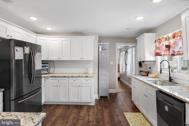 kitchen featuring sink, dark wood-type flooring, white cabinets, light stone countertops, and black appliances