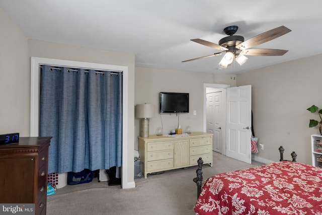 bedroom featuring ceiling fan and light carpet