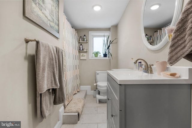 bathroom with vanity and toilet